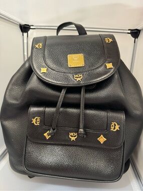 MCM Black Leather Backpack with Gold Logo Accents